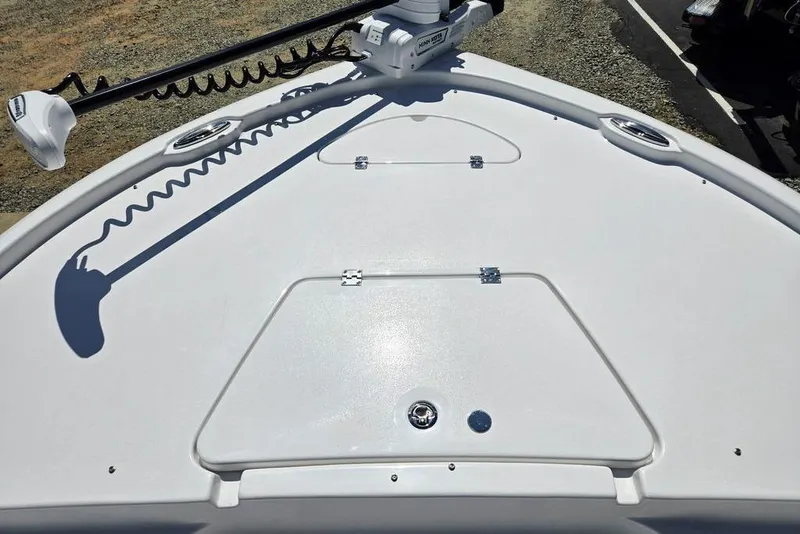 Slide: The Image of 2026 Tidewater 2210 Carolina Bay boat deck with trolling motor and storage compartments. - 44