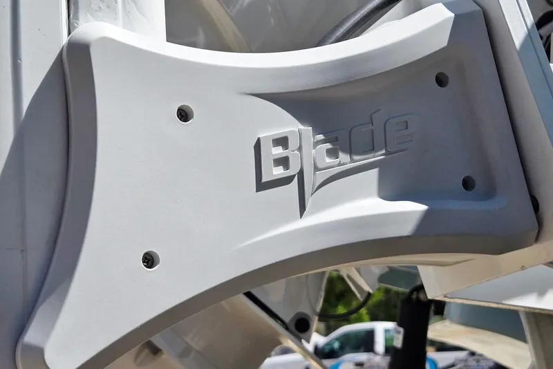Slide: The Image of Close-up of Blade logo on 2026 Tidewater 2210 Carolina Bay boat component. - 50