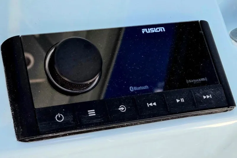 Slide: The Image of Fusion marine audio system with Bluetooth and SiriusXM, featured in 2026 Tidewater 2210 Carolina Bay. - 52