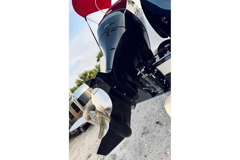 Slide: The Image of Outboard motor of a 2002 Boston Whaler 290 Outrage, featuring a shiny propeller. - 15