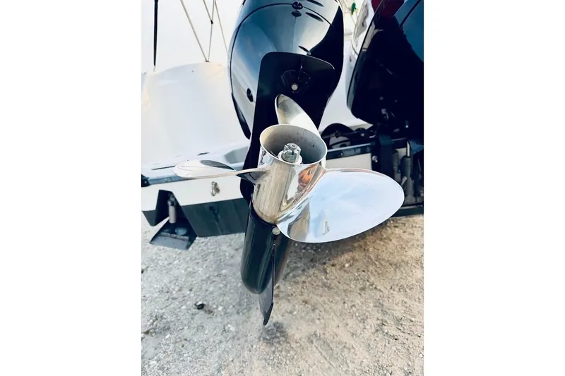 Slide: The Image of Close-up of a 2002 Boston Whaler 290 Outrage boat propeller on gravel. - 16