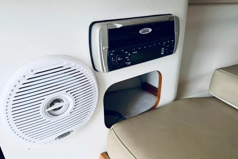 Slide: The Image of Clarion audio system and speaker in 2002 Boston Whaler 290 Outrage boat interior. - 43
