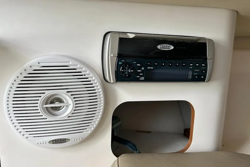 Slide: The Image of Clarion audio system and speaker on 2002 Boston Whaler 290 Outrage boat. - 58
