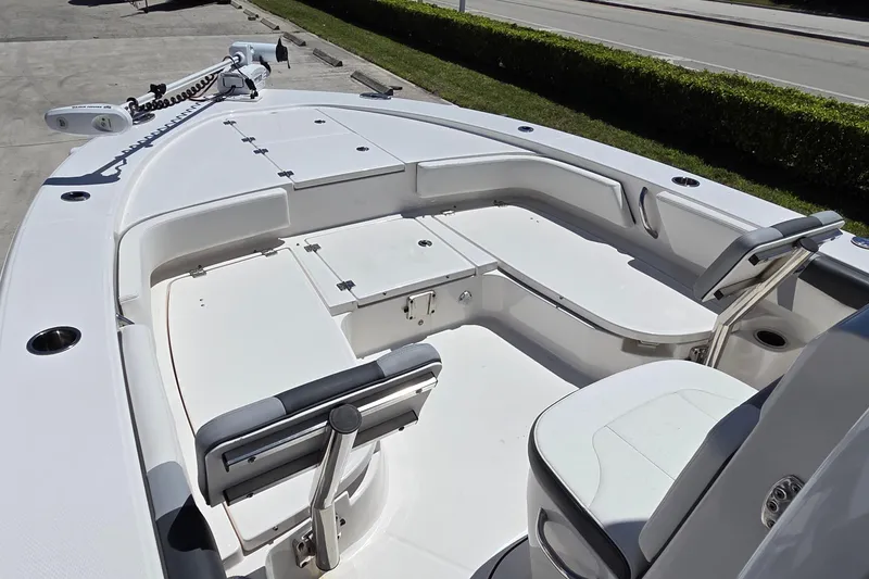 Slide: The Image of 2024 Robalo 246 Cayman boat interior with seating and storage compartments. - 15