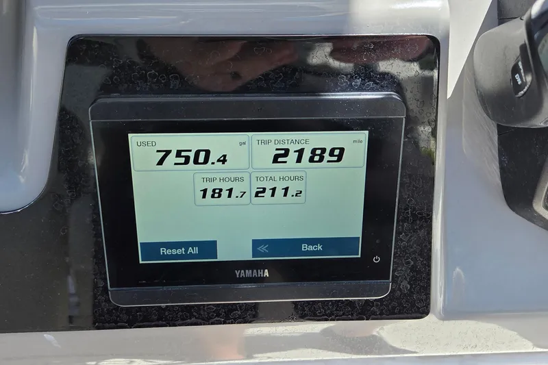 Slide: The Image of Yamaha display showing fuel usage and trip data on 2024 Robalo 246 Cayman boat. - 20