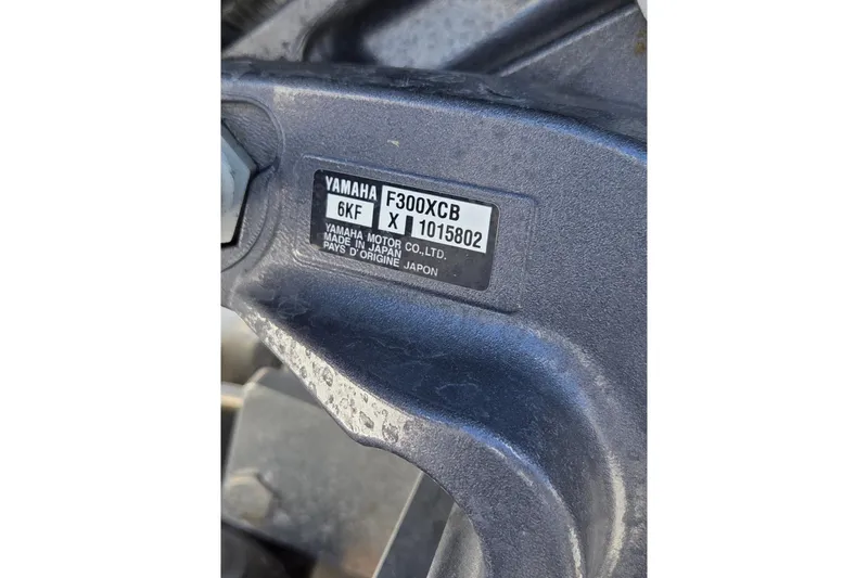Slide: The Image of Close-up of Yamaha F300XCB engine label on 2024 Robalo 246 Cayman boat. - 24
