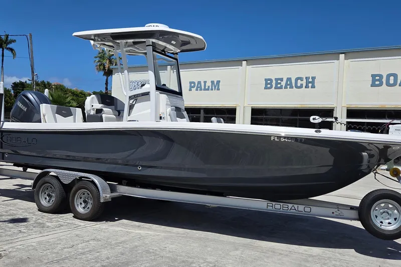 Slide: The Image of 2024 Robalo 246 Cayman boat on trailer at Palm Beach dealership. - 3