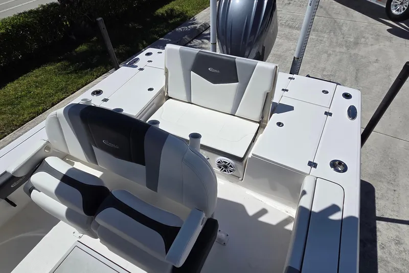 Slide: The Image of 2024 Robalo 246 Cayman boat interior with seating and storage compartments. - 4