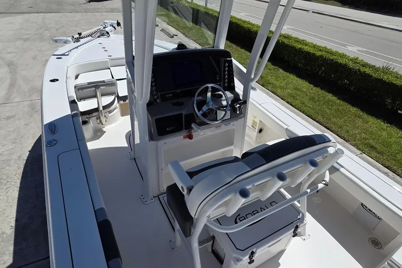 Slide: The Image of 2024 Robalo 246 Cayman boat interior with steering console and seating. - 5