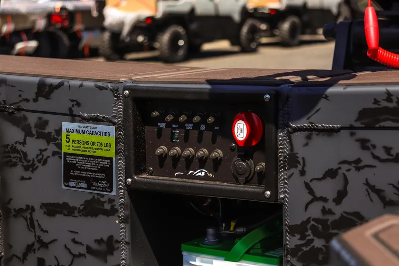 Slide: The Image of Control panel of 2026 Gator Tail 18/60 Extreme Series boat with capacity label. - 11