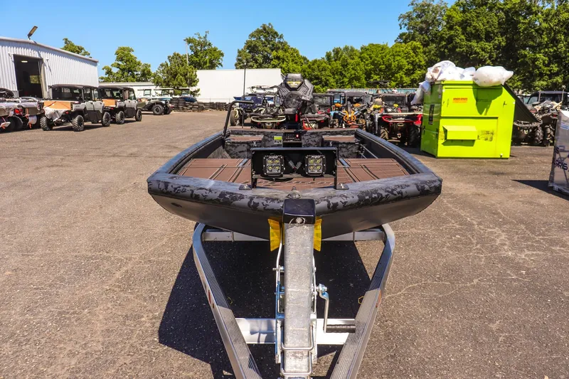 Slide: The Image of 2026 Gator Tail 18/60 Extreme Series boat on trailer in outdoor lot. - 2