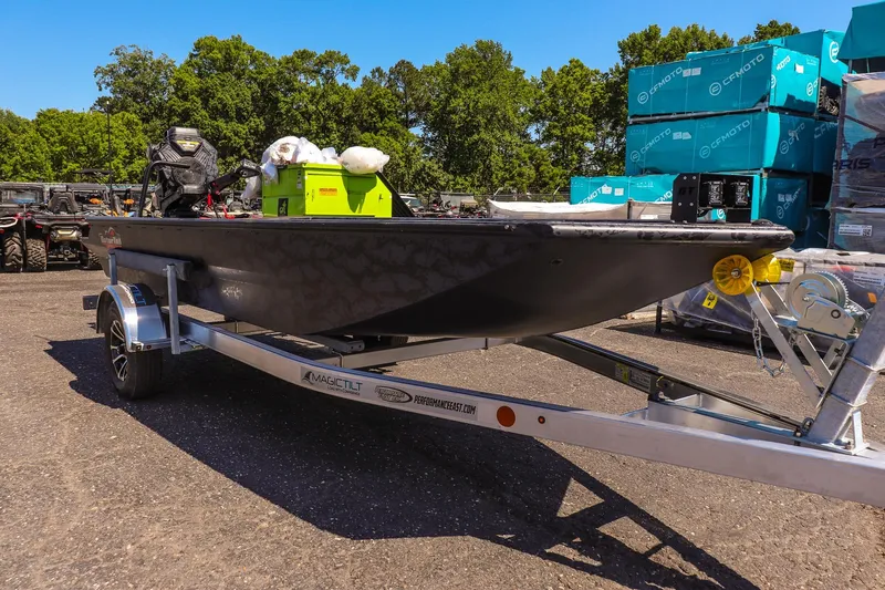 Slide: The Image of 2026 Gator Tail 18/60 Extreme Series boat on trailer, outdoor setting. - 3