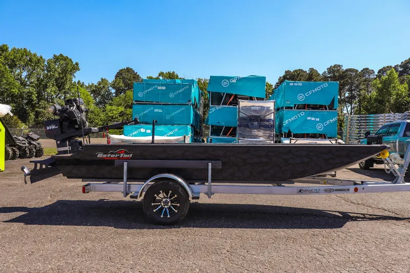 Slide: The Image of 2026 Gator Tail 18/60 Extreme Series boat on trailer, parked outdoors. - 4