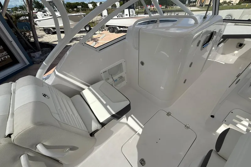 Slide: The Image of Interior of 2026 Edgewater 248CX Crossover boat, featuring sleek seating and modern design. - 20
