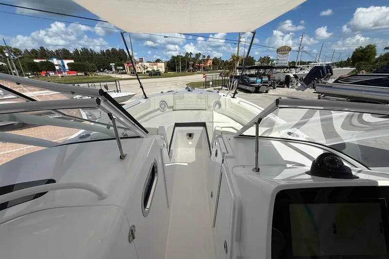 Slide: The Image of 2026 Edgewater 248CX Crossover boat interior with modern design and spacious seating. - 21