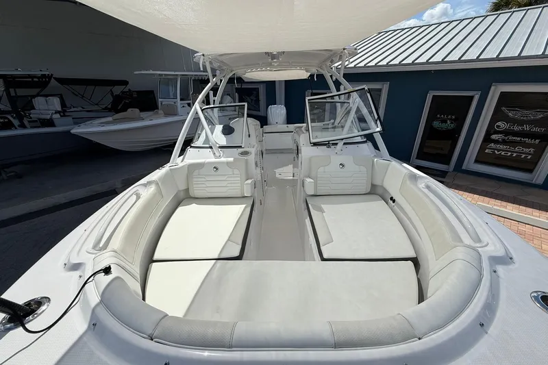 Slide: The Image of 2026 Edgewater 248CX Crossover boat interior with spacious seating and modern design. - 23