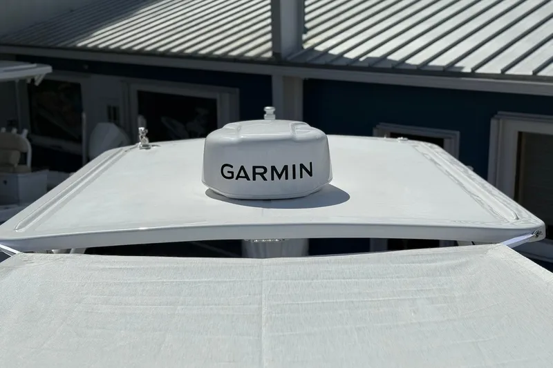 Slide: The Image of 2026 Edgewater 248CX Crossover boat with Garmin radar on the roof. - 24