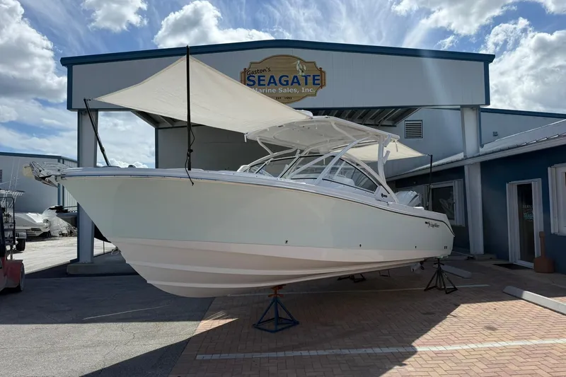 Slide: The Image of 2026 Edgewater 248CX Crossover boat displayed at Seagate Marine Sales. - 3
