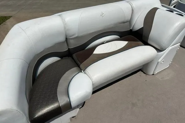 Slide: The Image of Luxurious seating on 2013 JC 23 Neptoon TT pontoon boat, featuring stylish upholstery design. - 10