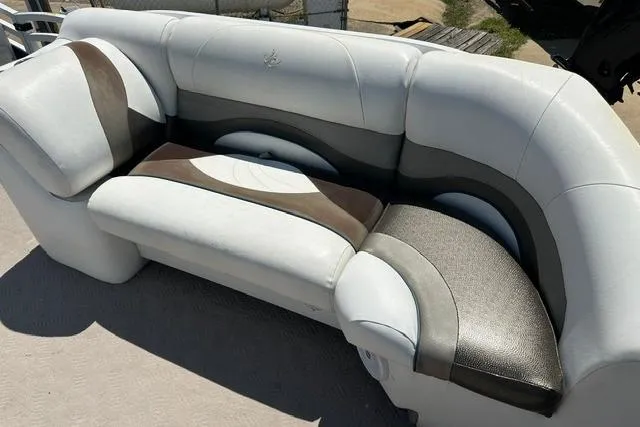 Slide: The Image of Luxurious seating on 2013 JC 23 Neptoon TT pontoon boat, featuring elegant design and comfort. - 11