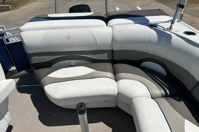 Slide: The Image of 2013 JC 23 Neptoon TT boat interior with white and gray seating arrangement. - 16