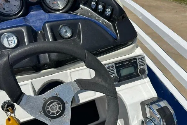 Slide: The Image of Steering console of 2013 JC 23 Neptoon TT boat with gauges and controls. - 20