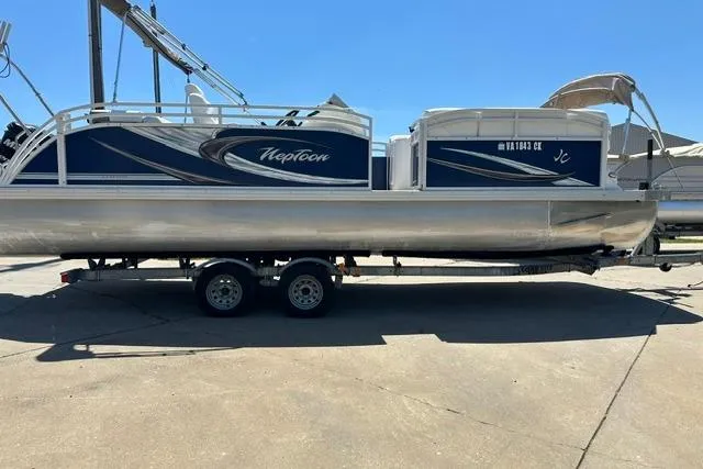 Slide: The Image of 2013 JC 23 Neptoon TT pontoon boat on trailer, parked outdoors. - 8