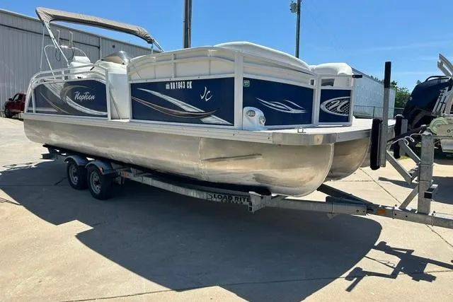 Slide: The Image of 2013 JC 23 Neptoon TT pontoon boat on trailer, parked outdoors. - 9