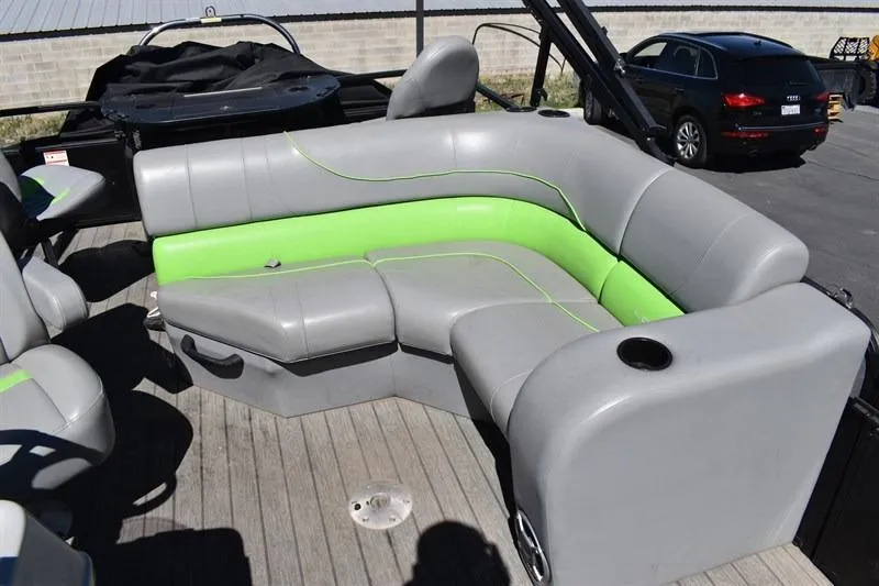Slide: The Image of 2022 Lowe SF 212 Sport Fish boat with gray and green seating on deck. - 18