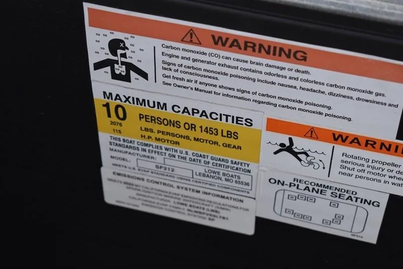 Slide: The Image of Warning label on 2022 Lowe SF 212 Sport Fish boat detailing capacity and safety information. - 28
