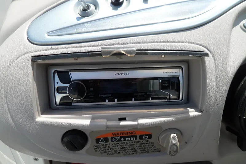 Slide: The Image of Kenwood stereo system in a 2003 Maxum 2400 SC boat dashboard. - 11