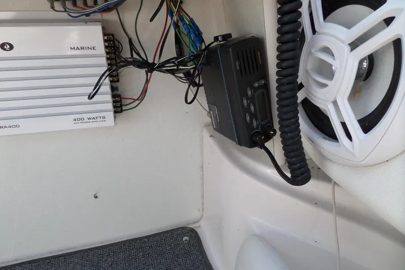 Slide: The Image of 2003 Maxum 2400 SC boat interior with marine amplifier and radio equipment. - 15