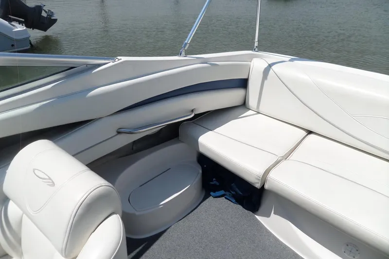 Slide: The Image of 2003 Maxum 2400 SC boat interior with white seating and blue accents. - 18