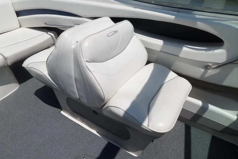 Slide: The Image of White leather seat on 2003 Maxum 2400 SC boat interior. - 22