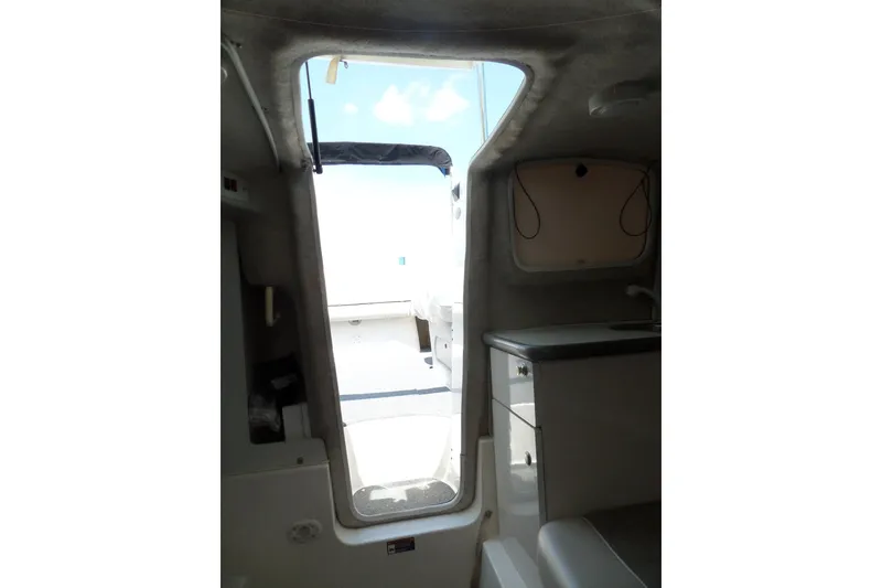 Slide: The Image of Interior view of 2003 Maxum 2400 SC boat cabin with open hatch. - 29