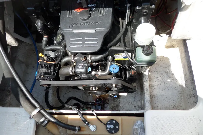 Slide: The Image of Engine compartment of a 2003 Maxum 2400 SC boat, featuring a Mercury MPI engine. - 35