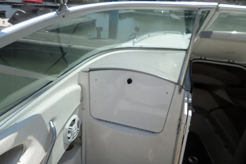 Slide: The Image of 2003 Maxum 2400 SC boat interior with open cabin door and visible speaker. - 7