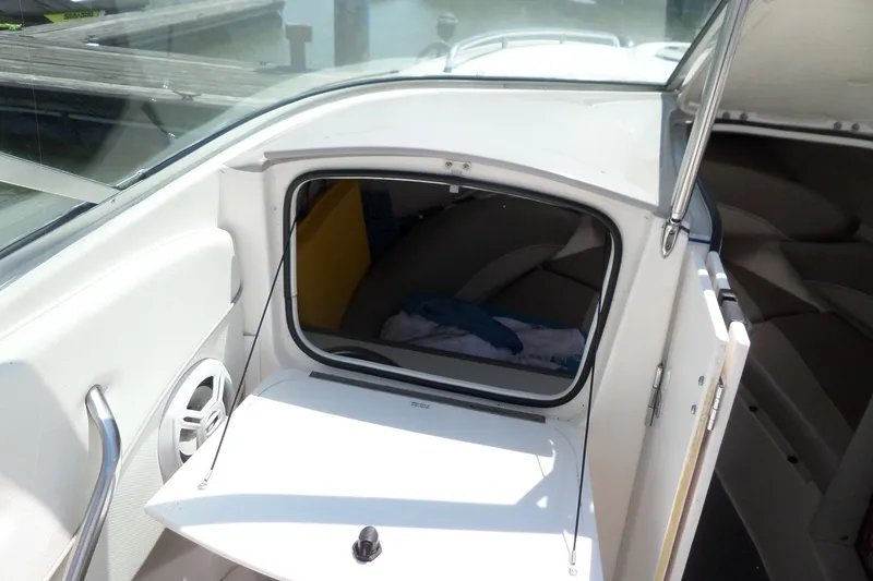 Slide: The Image of 2003 Maxum 2400 SC boat cabin entrance with open hatch and interior view. - 8