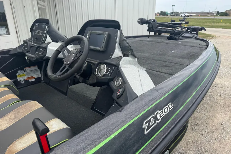 Slide: The Image of 2018 Skeeter ZX200 boat interior with steering wheel and dashboard controls. - 6