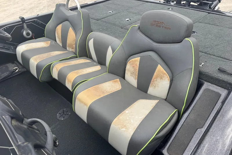 Slide: The Image of 2018 Skeeter ZX200 boat seats with gray and tan upholstery, featuring lime green accents. - 9