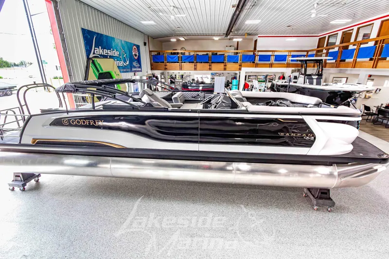 Slide: The Image of 2026 Godfrey Sanpan 2700 MTF pontoon boat displayed in showroom. - 4