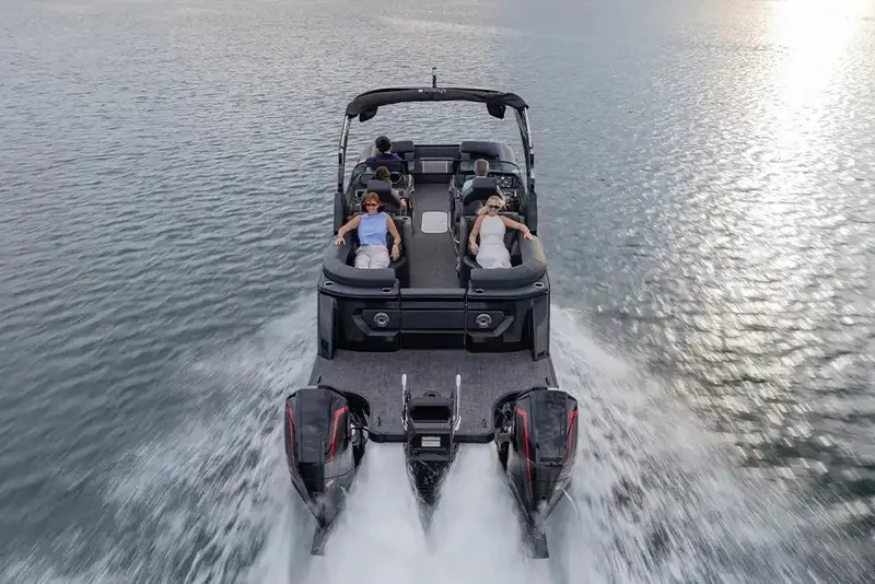 Slide: The Image of Manufacturer Provided Image: Manufacturer Provided Image: 2026 Godfrey Sanpan 2300 SBC cruising on water with passengers relaxing. - 8
