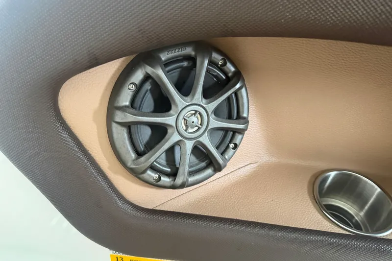 Slide: The Image of Speaker and cup holder in 2012 Cobalt 242 boat interior. - 14