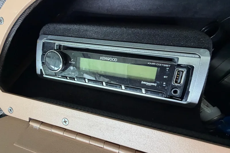 Slide: The Image of Kenwood stereo system in a 2012 Cobalt 242 boat dashboard. - 22