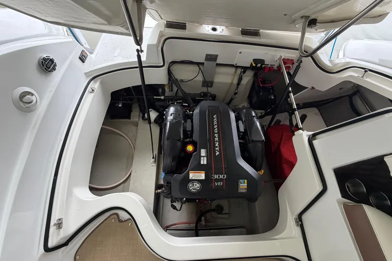 Slide: The Image of Engine compartment of a 2012 Cobalt 242 boat featuring a Volvo Penta 300 V8 engine. - 34
