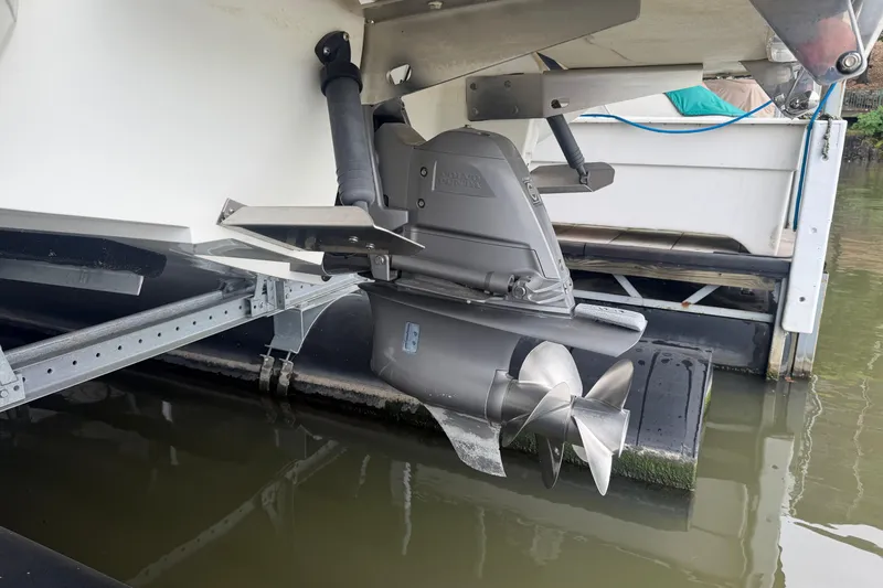 Slide: The Image of 2012 Cobalt 242 boat with Volvo Penta outdrive, docked in water. - 37