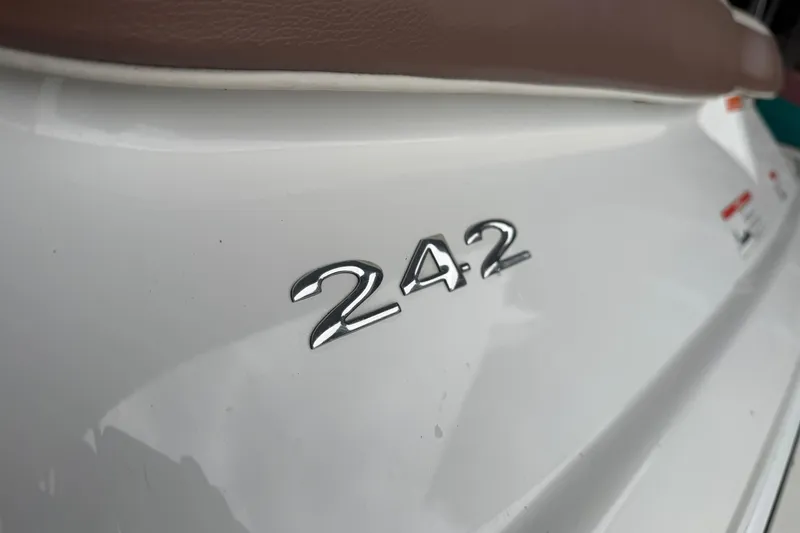 Slide: The Image of Close-up of 2012 Cobalt 242 model emblem on white surface. - 38
