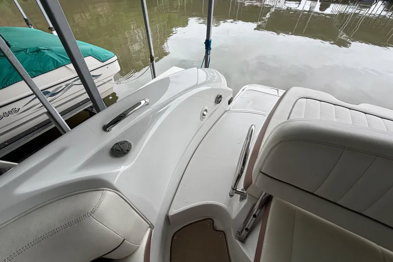 Slide: The Image of Interior view of a 2012 Cobalt 242 boat, showcasing seating and deck details. - 9