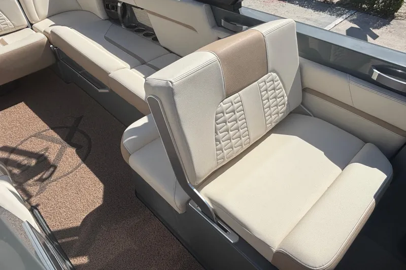 Slide: The Image of Luxurious seating in a 2022 MasterCraft X26 boat, featuring beige upholstery and modern design. - 12