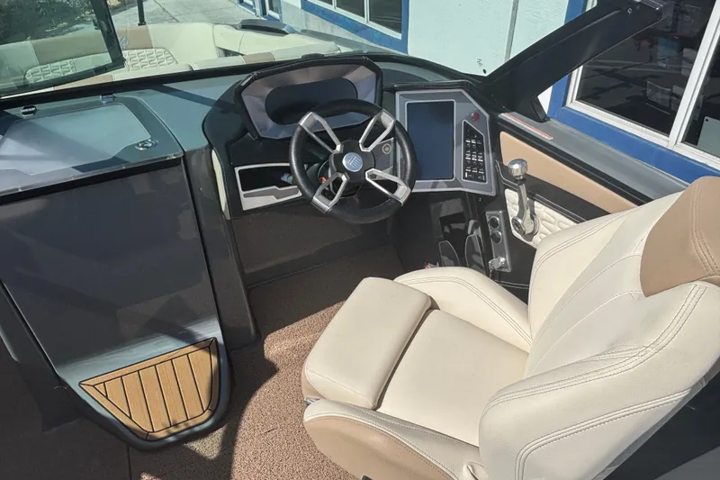 Slide: The Image of Interior of 2022 MasterCraft X26 boat with modern steering and controls. - 5